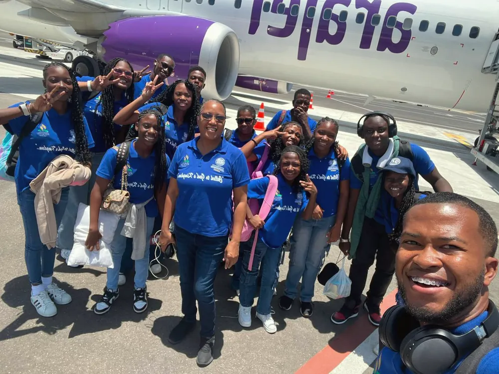 The mission team gathered on the airport apron
