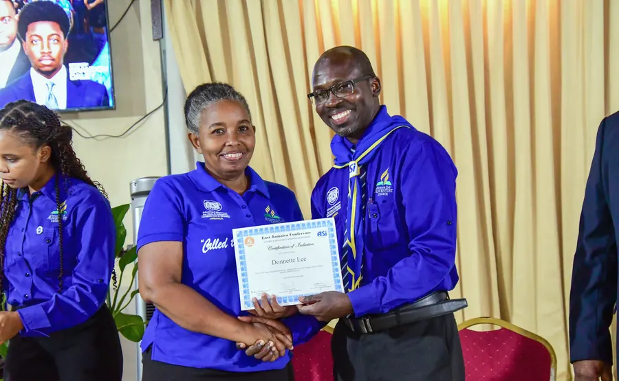 A missionary receives a certificate of induction