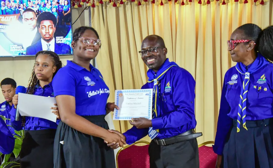 A missionary receives a certificate of induction