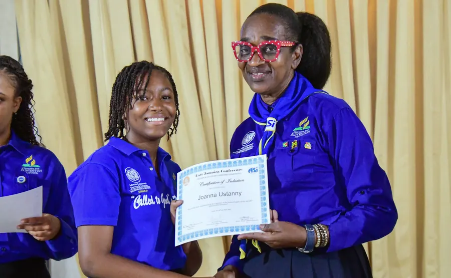A missionary receives a certificate of induction