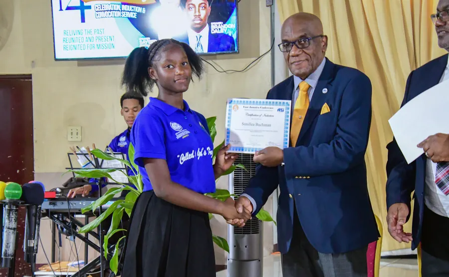 A missionary receives a certificate of induction
