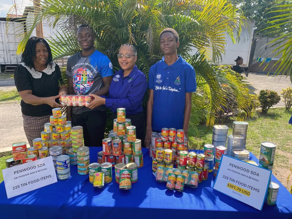 Members with the Hurricane Melissa relief collection of tinned food